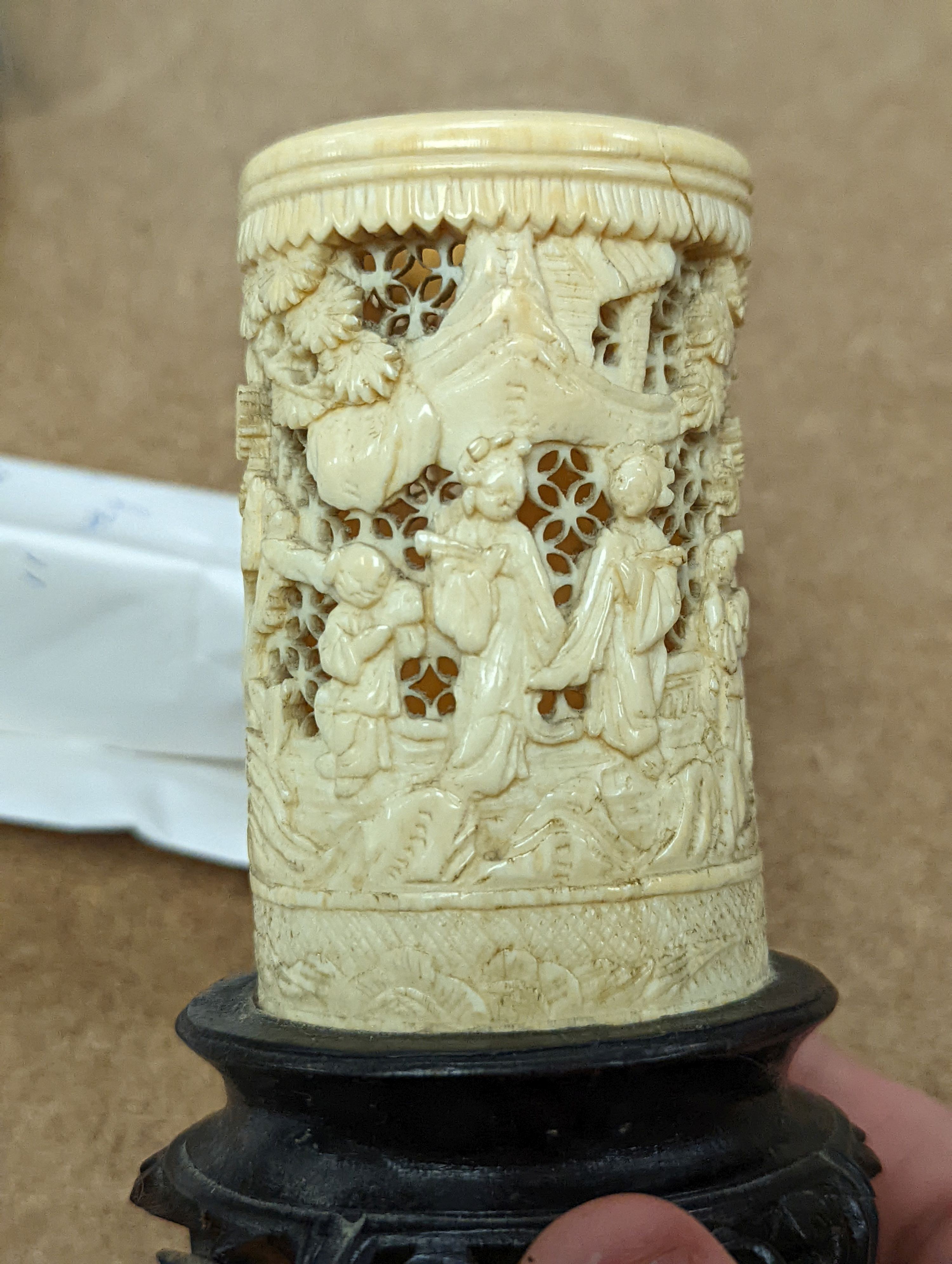 A pair of 19th century Chinese carved ivory brushpots on wooden stands - 12cm tall (including stands)